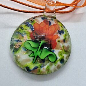 Art glass blown glass pendant on orange ribbon necklace